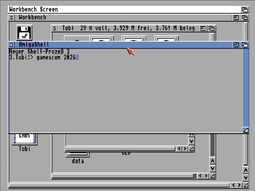 Amiga Workbench Screenshot mit geöffnetem AmigaShell‑Fenster und eingegebenem Befehl „gamescom 2026“, graue Oberfläche, rote Mauszeiger‑Hand.